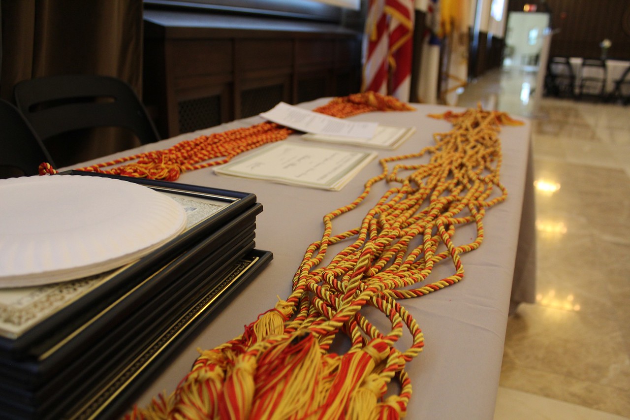 close-up of awards table with awards and cords