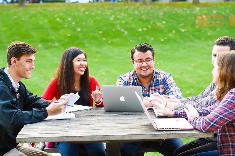 Students on campus laughing