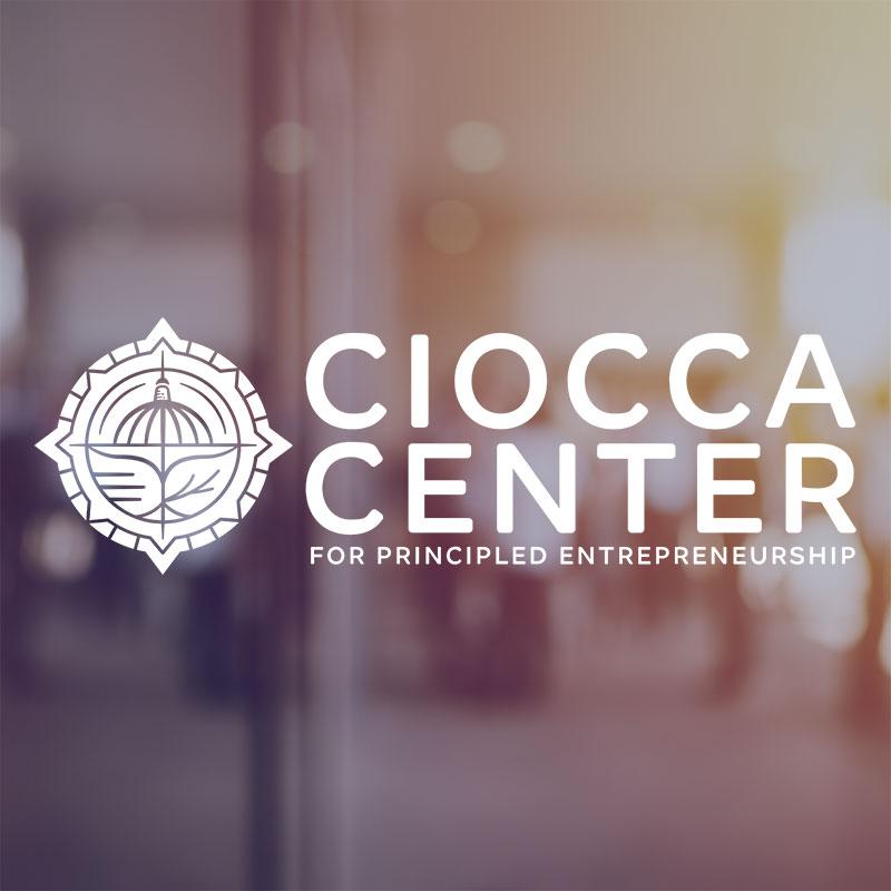 Ciocca Center logo on ambient office background.
