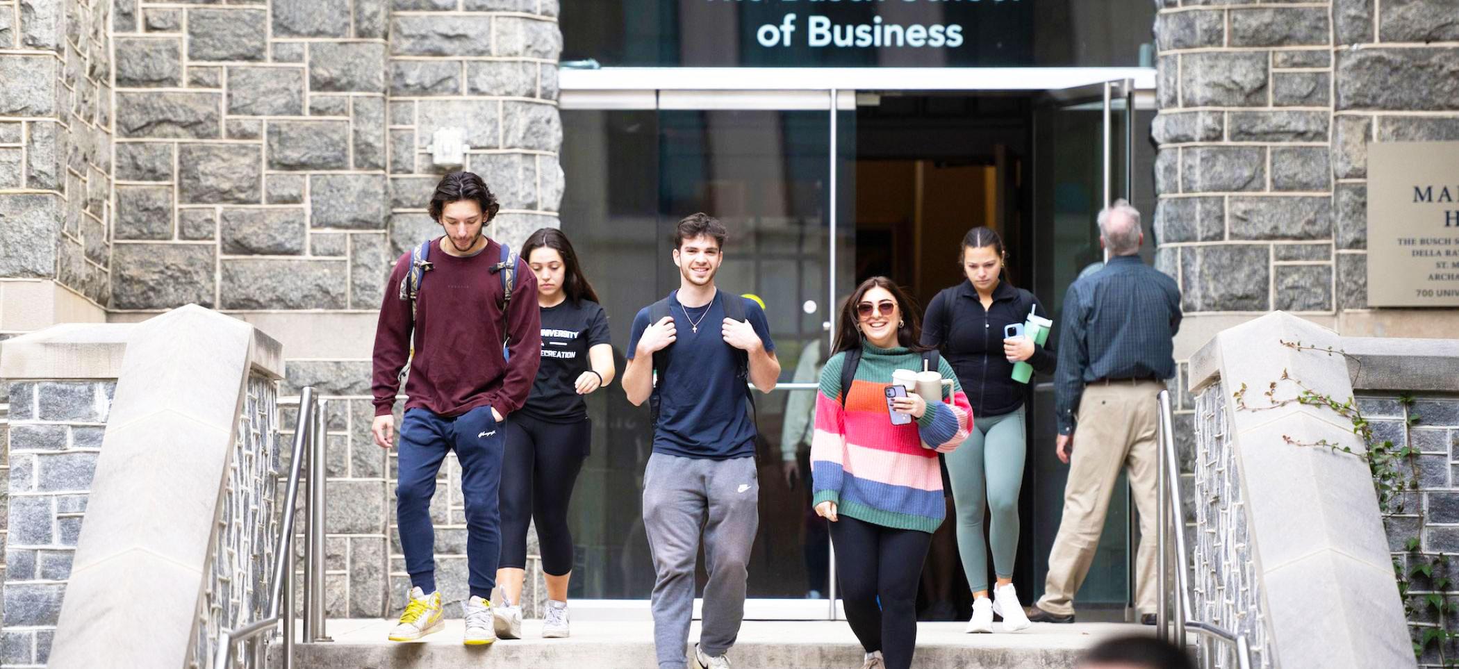 Students on the front steps of Maloney Hall.