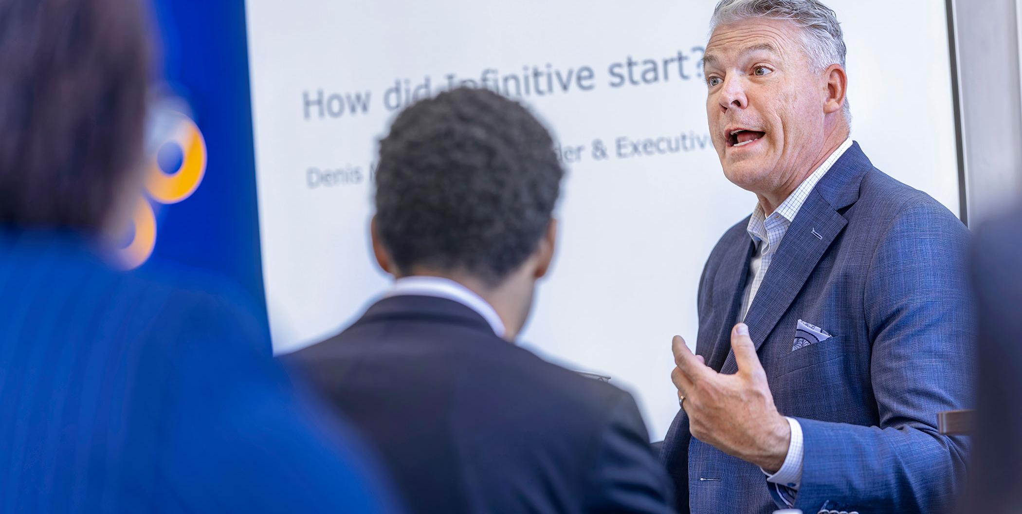 Business professor mentoring students.