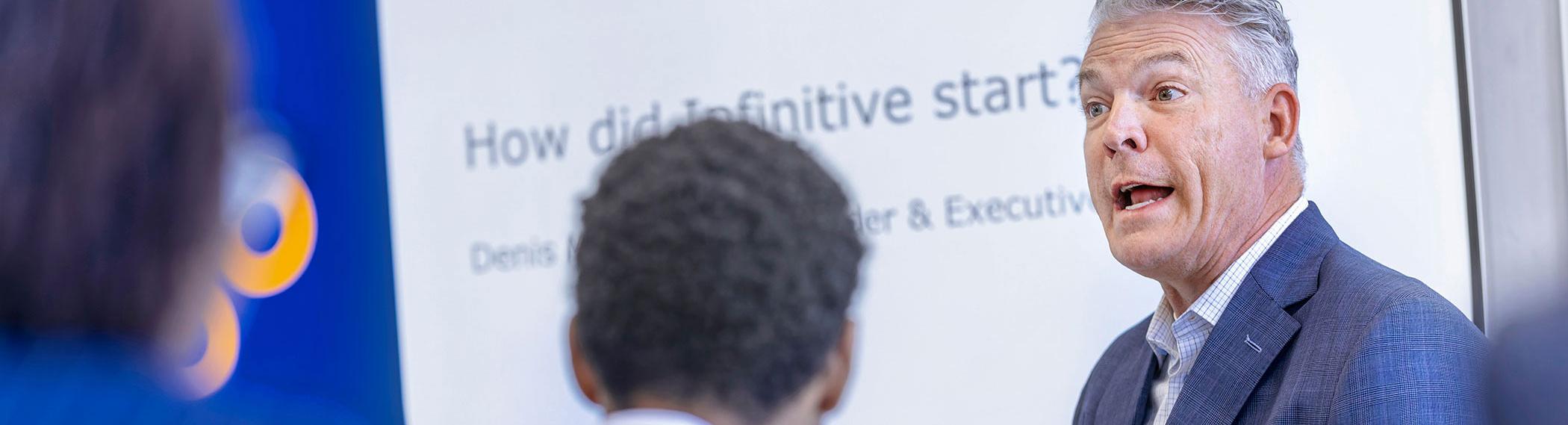Business professor mentoring students.