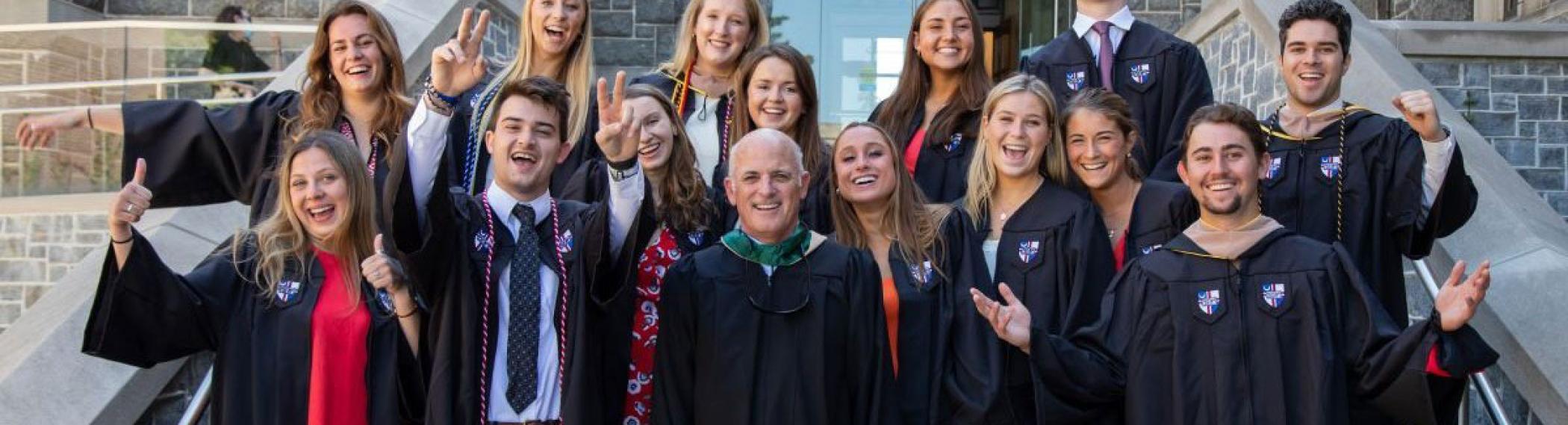 Sales graduates in front of Maloney Hall.