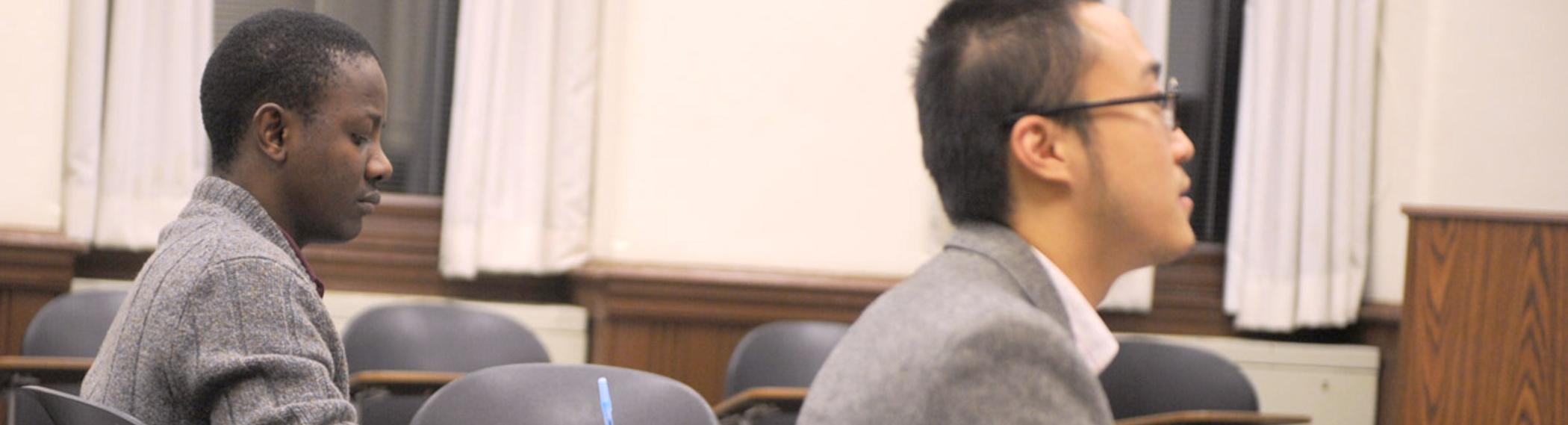racially diverse students paying attention in class