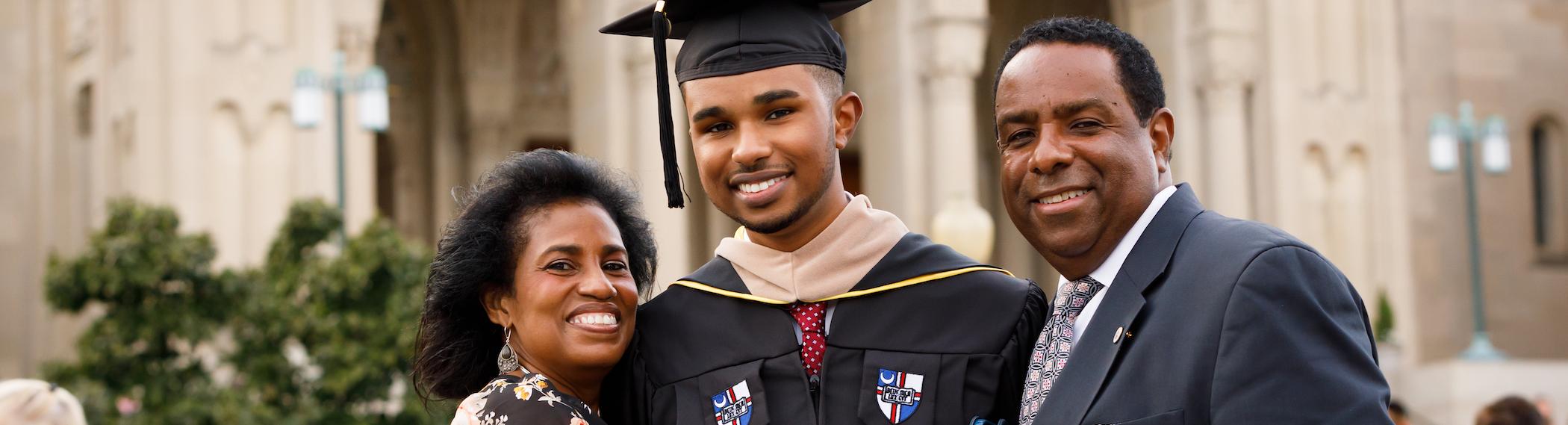parents hugging their CUA graduate