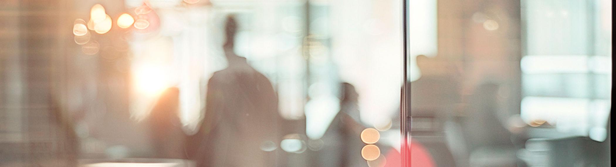 Ambient background image of people mingling in a business setting.