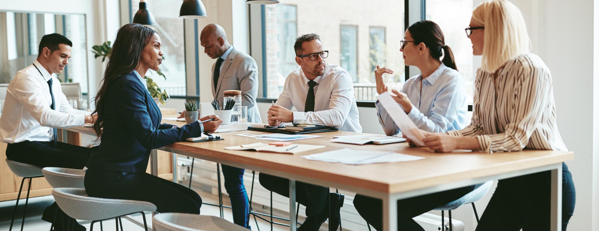 group of professionals collaborating at a table
