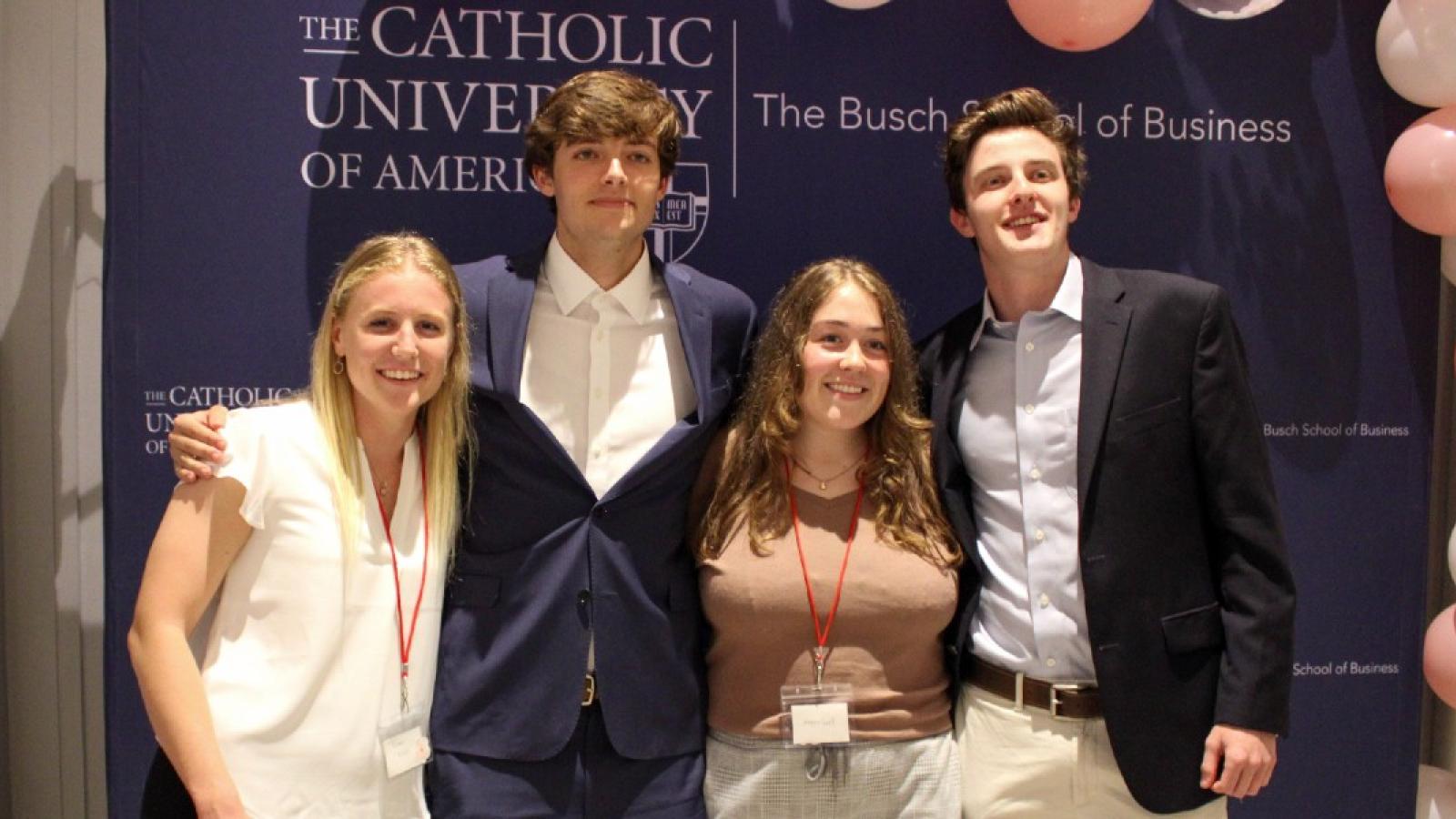 cooper and some friends dressed in business attire on campus