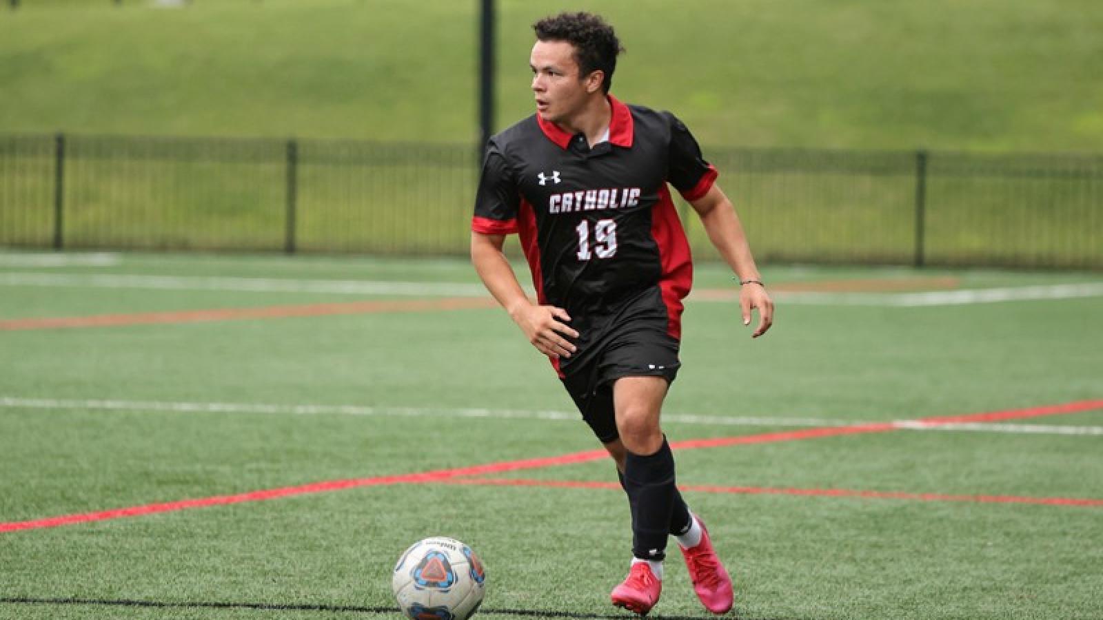 adam playing soccer on the CUA team