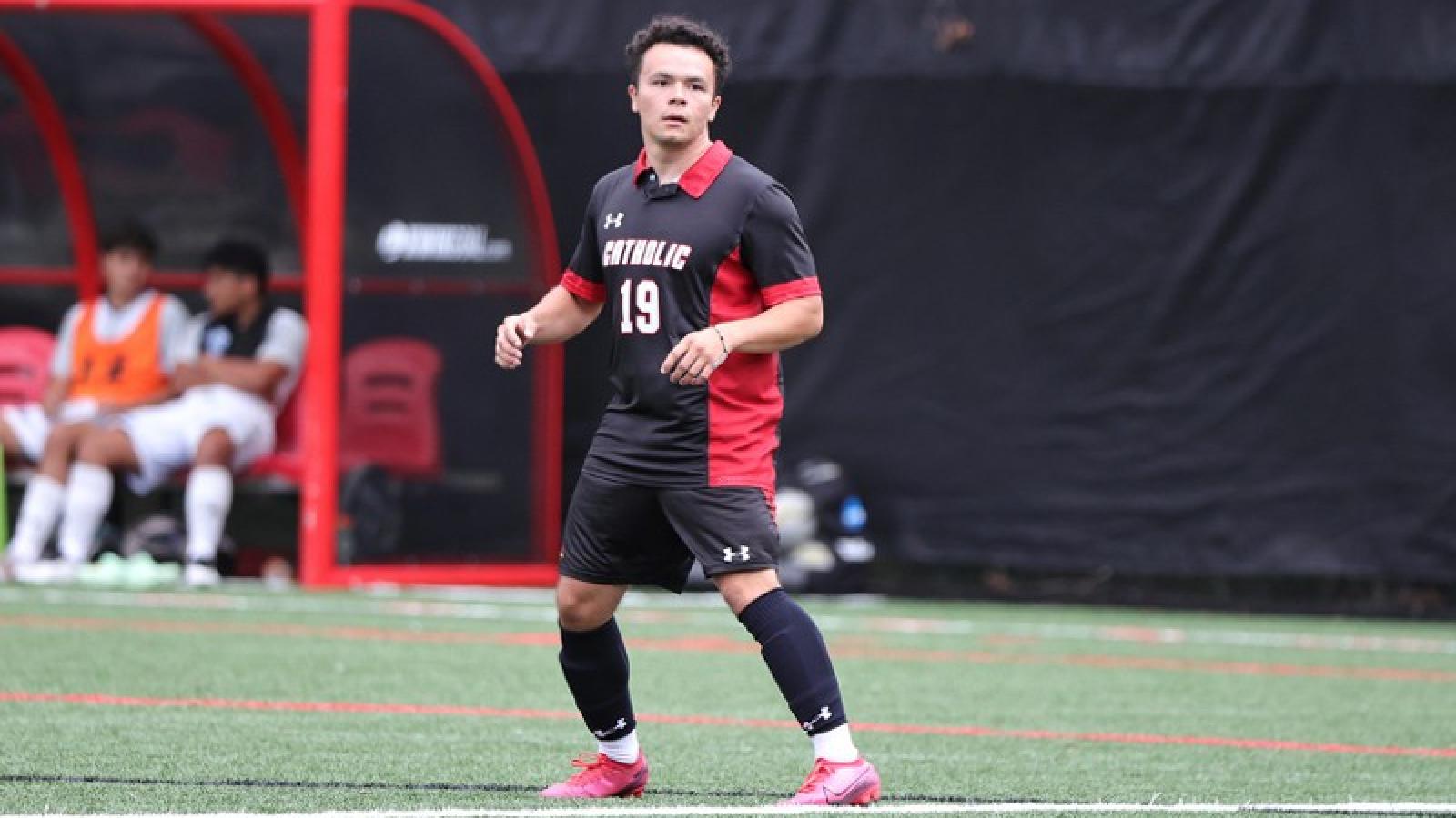adam playing soccer on the CUA team