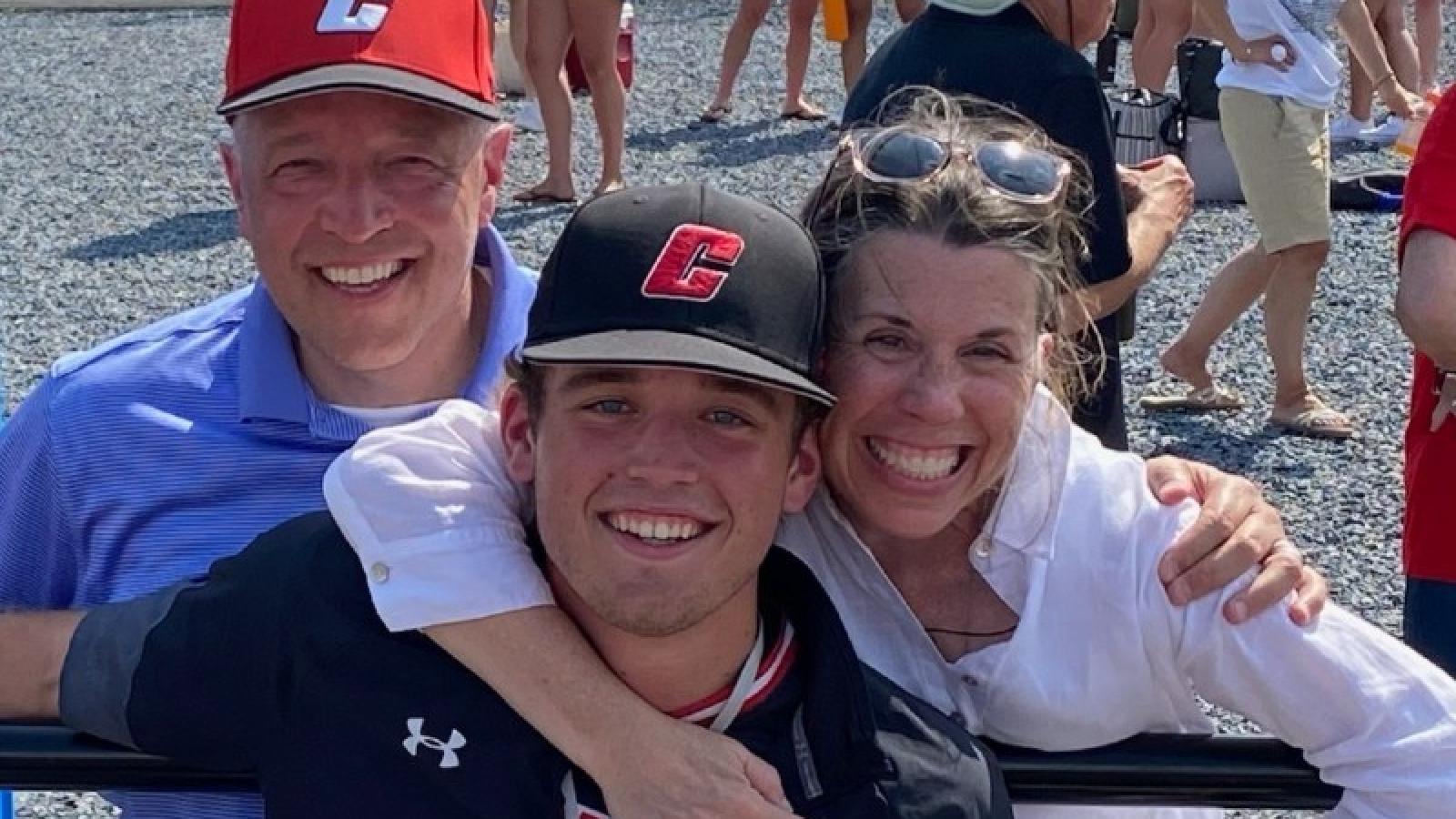 cormac and his parents at a CUA baseball game
