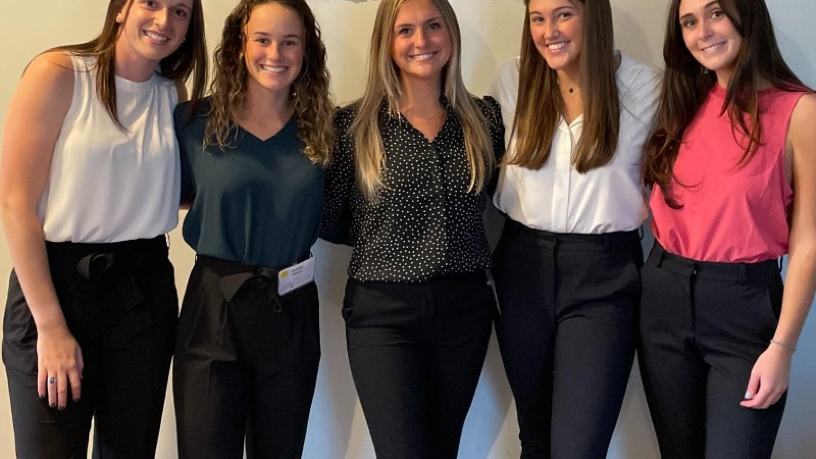 haley with friends dressed in business casual attire