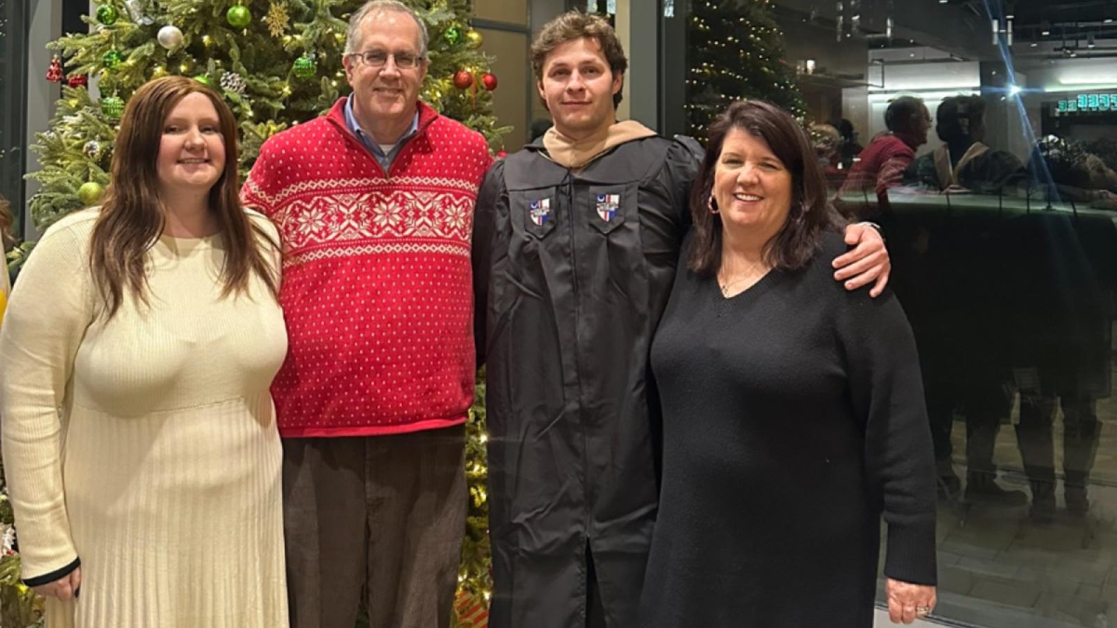 james with his family at december graduation
