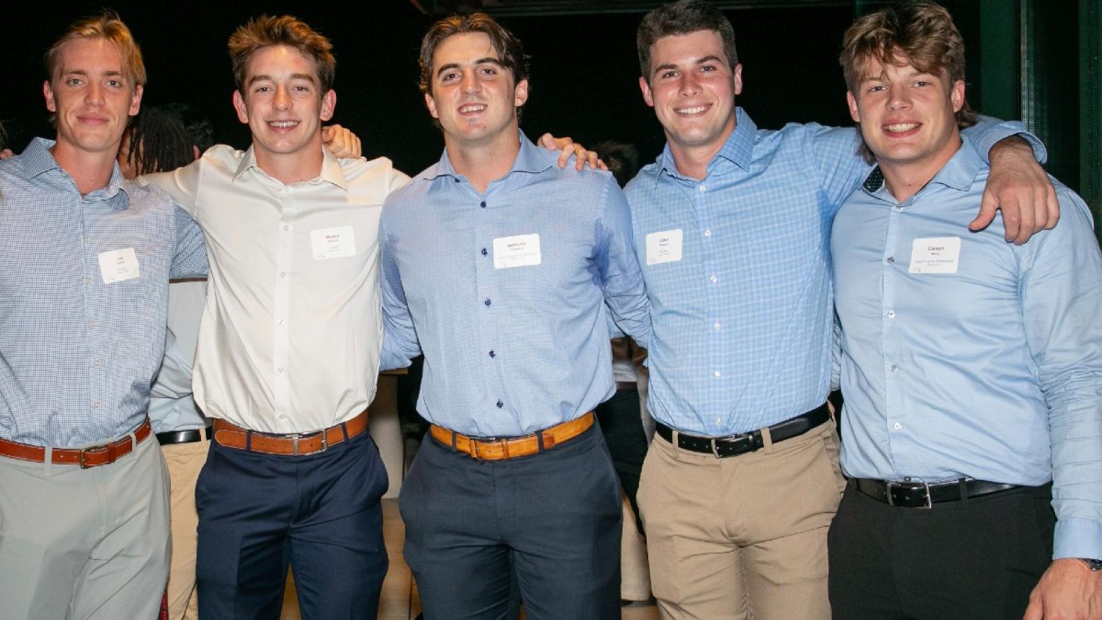 john smiling with some of his business friends