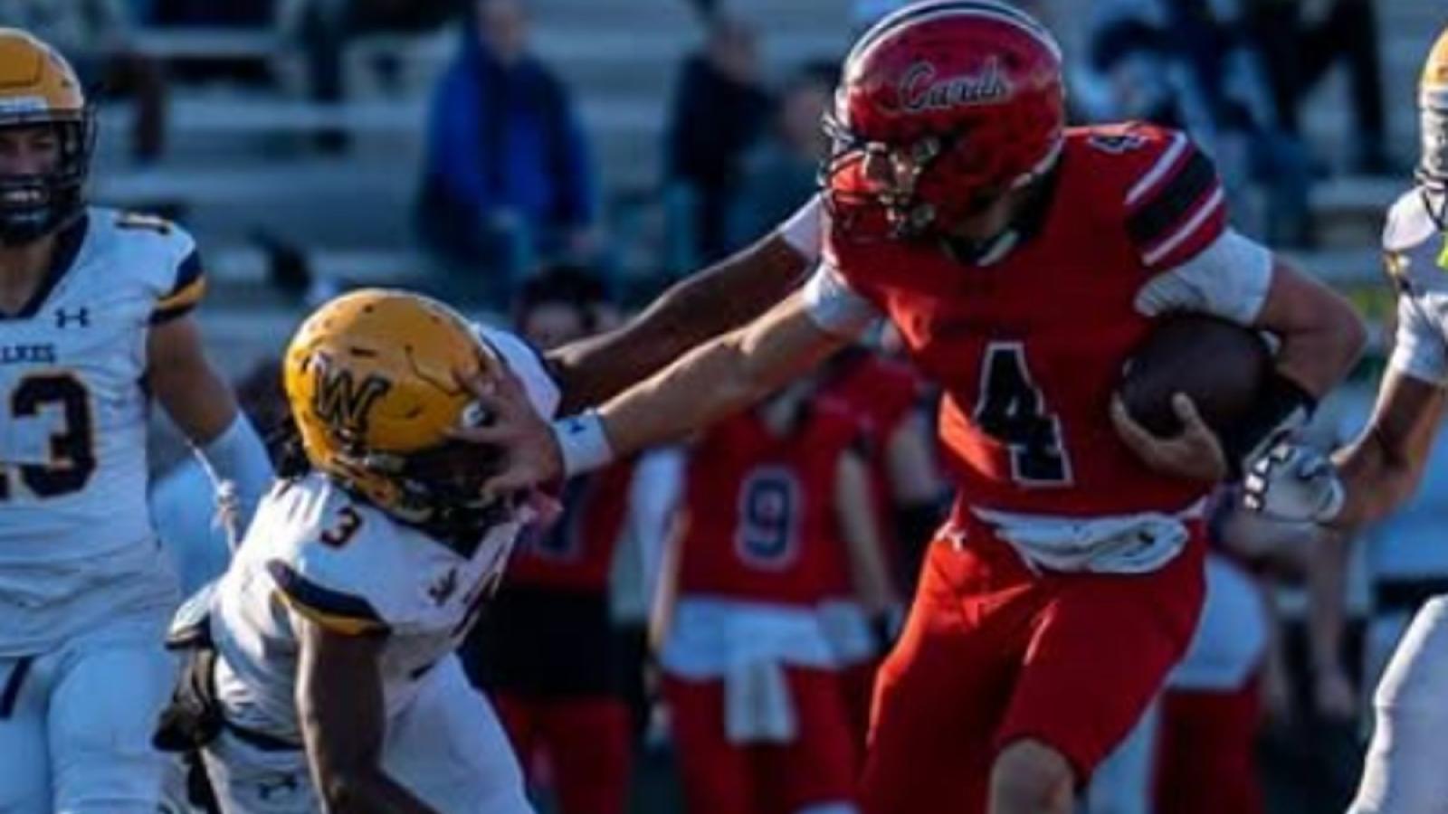 john playing football on the CUA Cardinals team