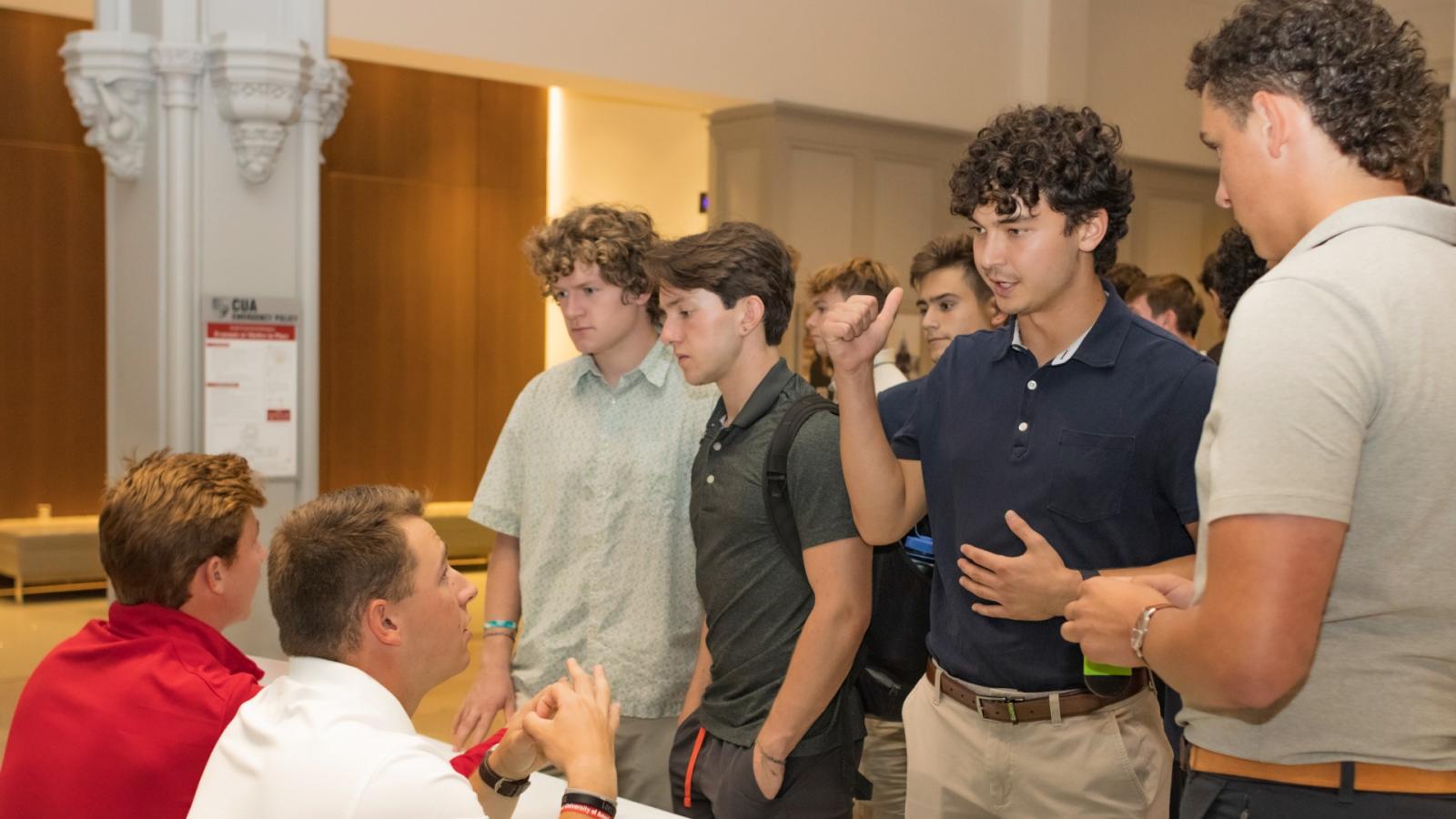 justin talking to students at a business school event