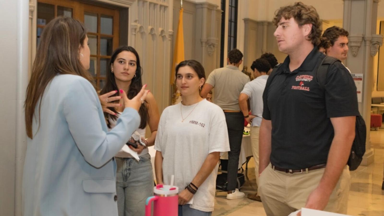 kelsey talking to other students