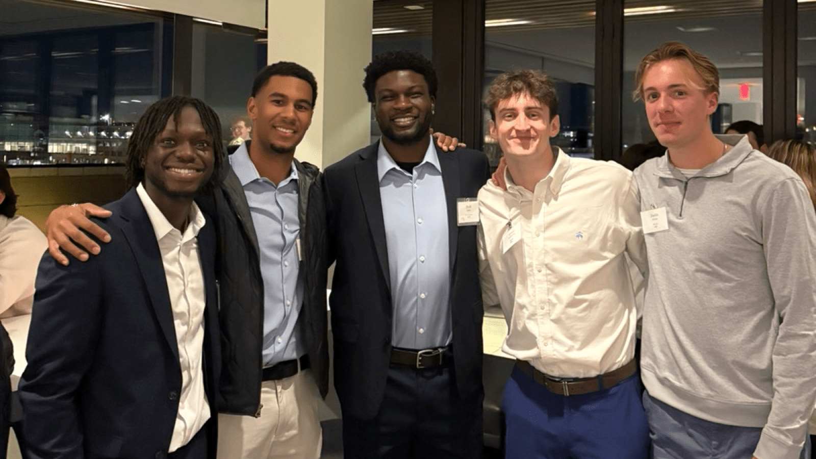 kwaku with fellow business students at a Busch School social event