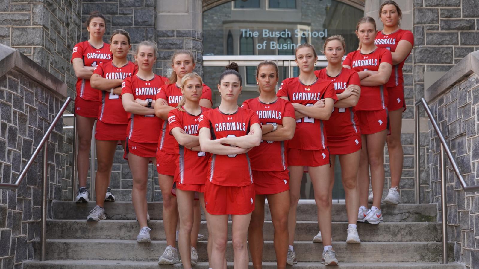 lauren and the women's lacrosse team on the steps of maloney hall