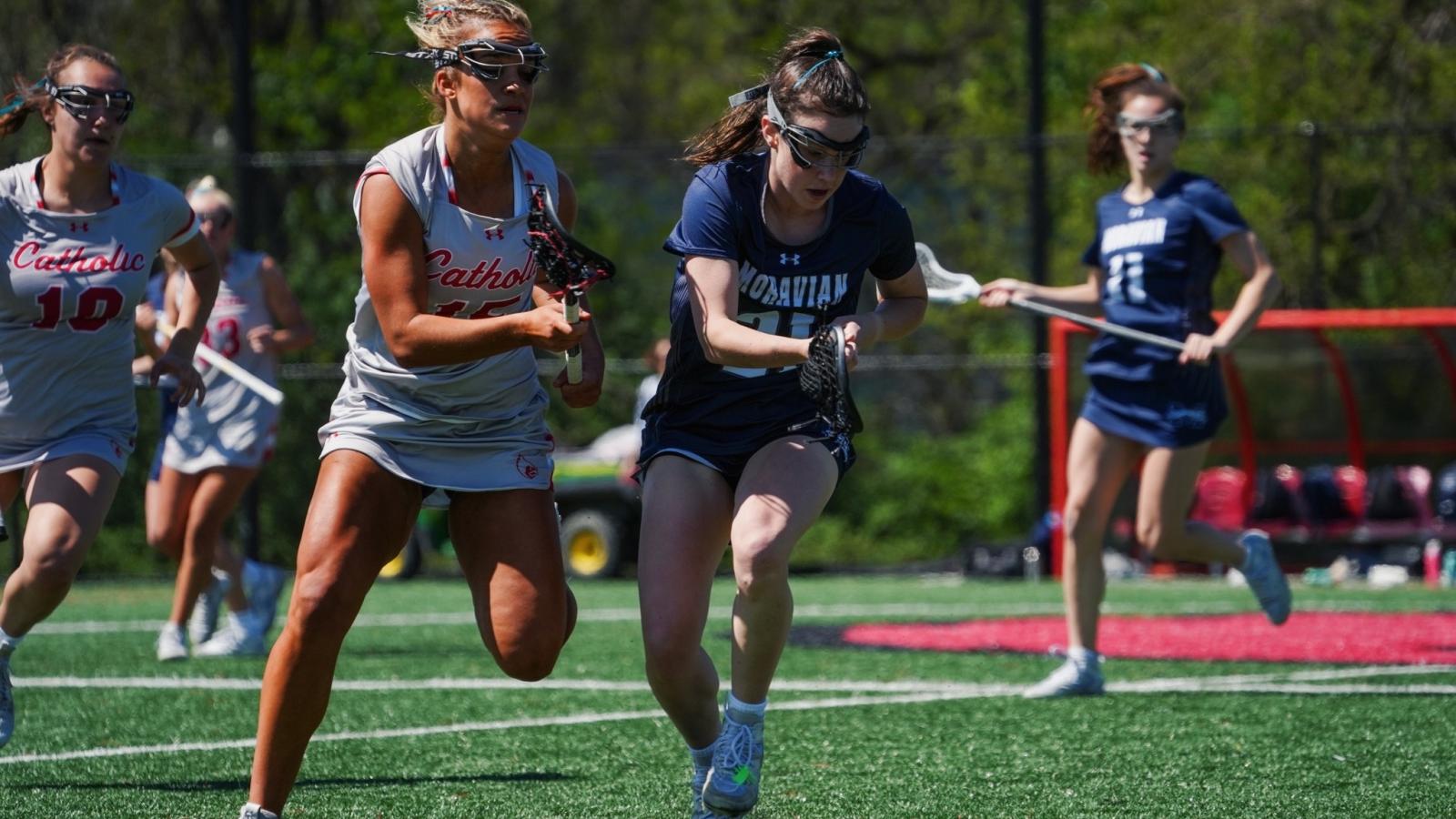 lauren playing lacrosse on the CUA women's team