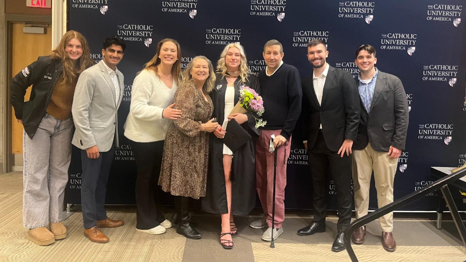 lauren at graduation with friends and family