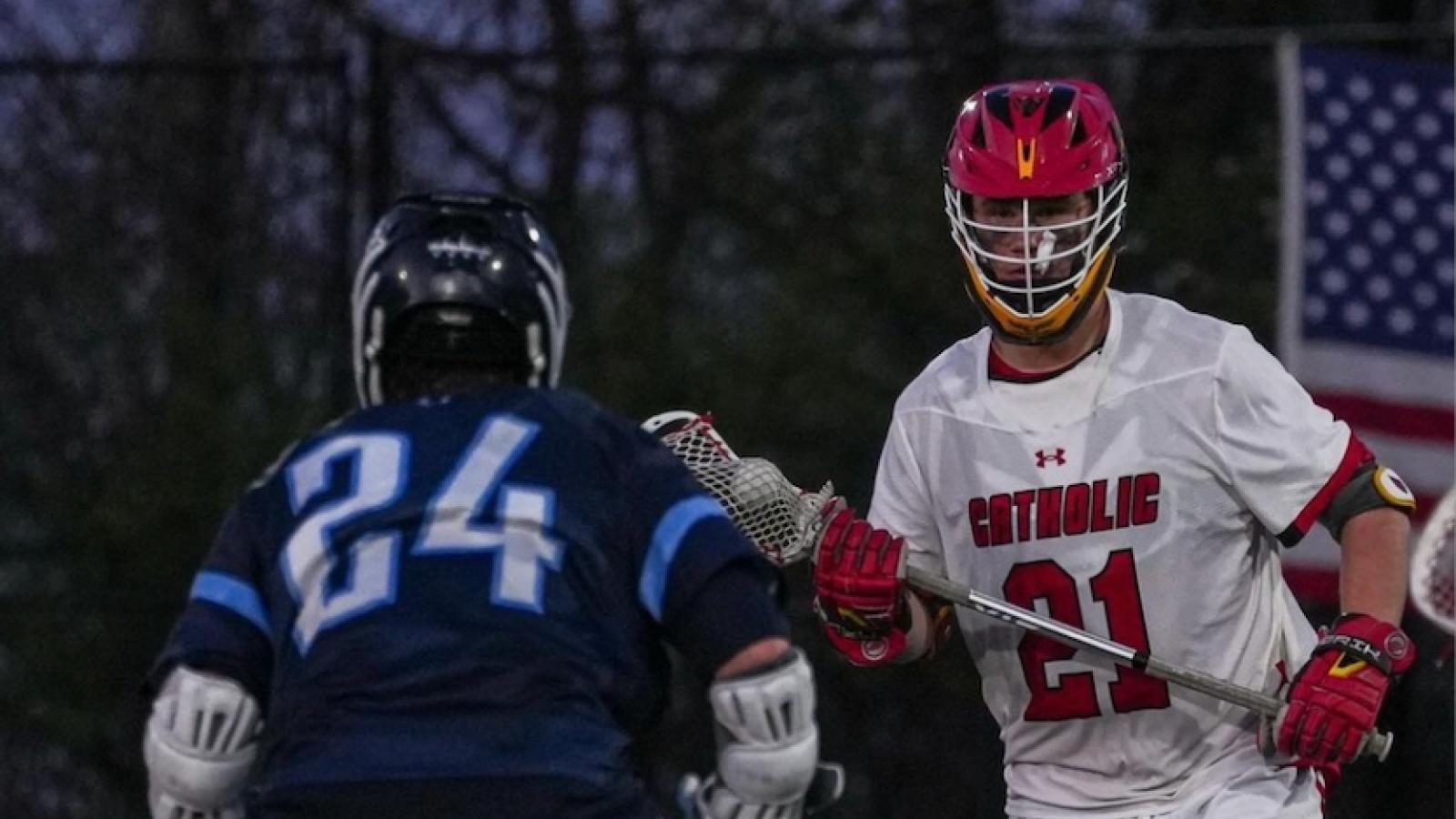 liam playing on the cua lacrosse team