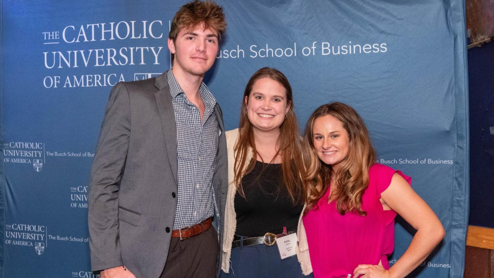 michael with friends at a busch school sales networking event