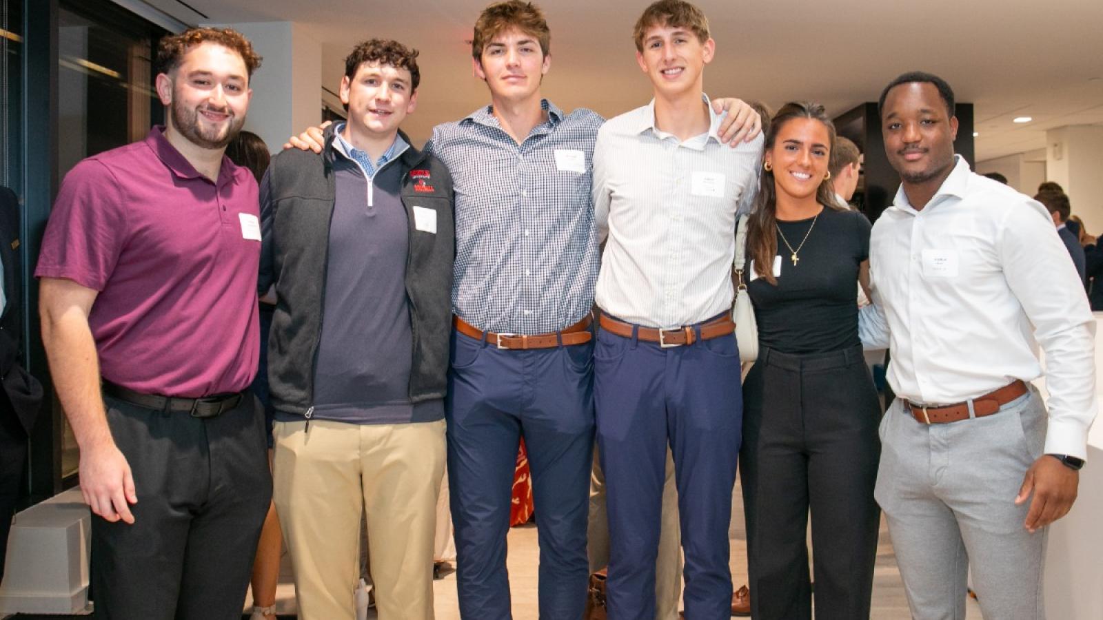 michael with friends at a busch school sales networking event