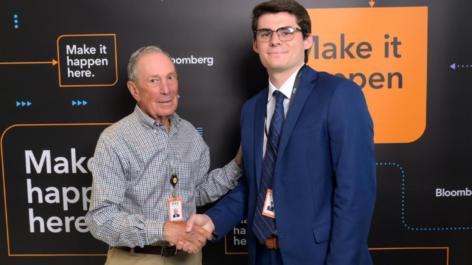 ryan shaking hands with someone at Bloomberg