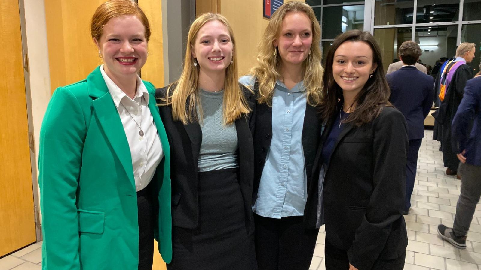 sophia with friends wearing business attire