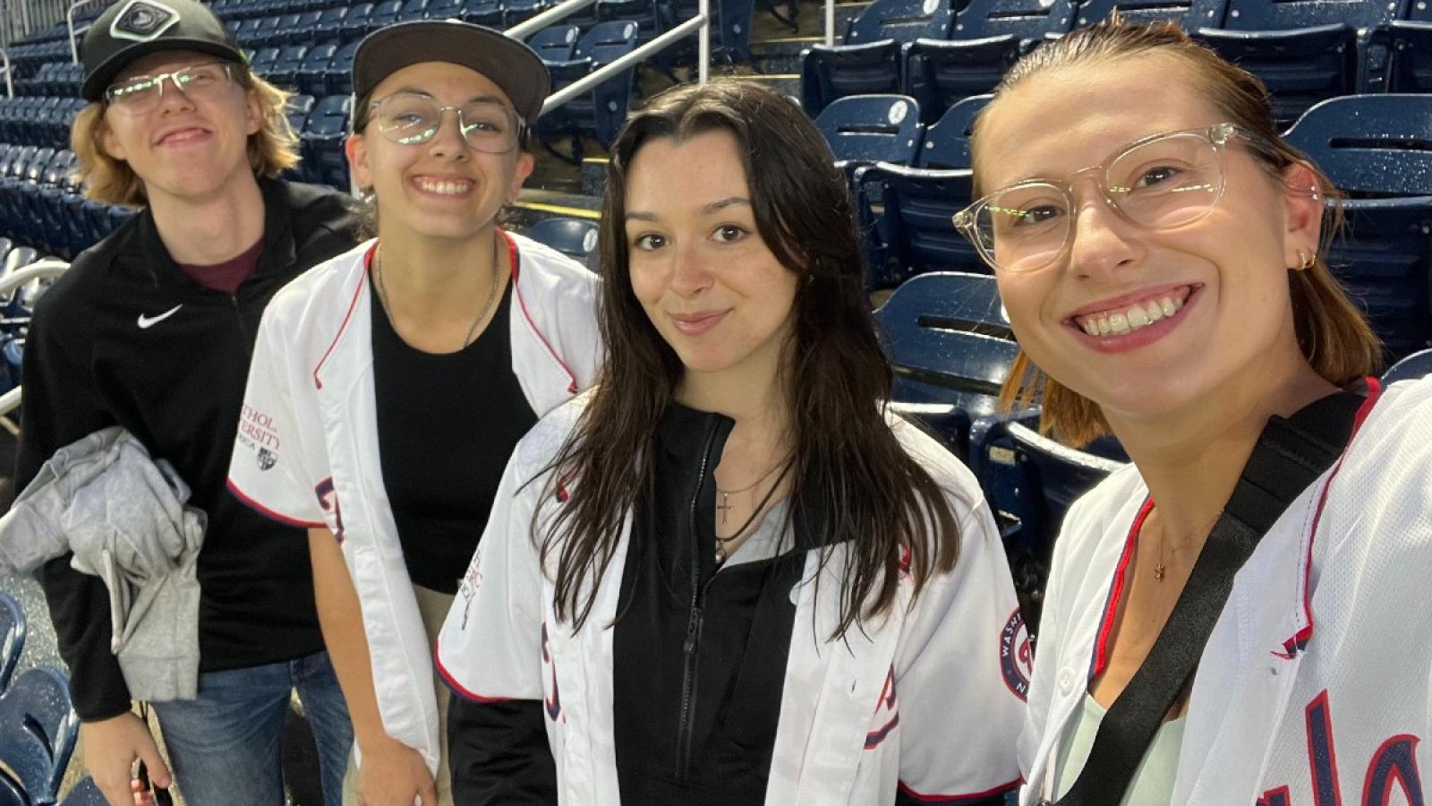 sophia at a nationals game with friends