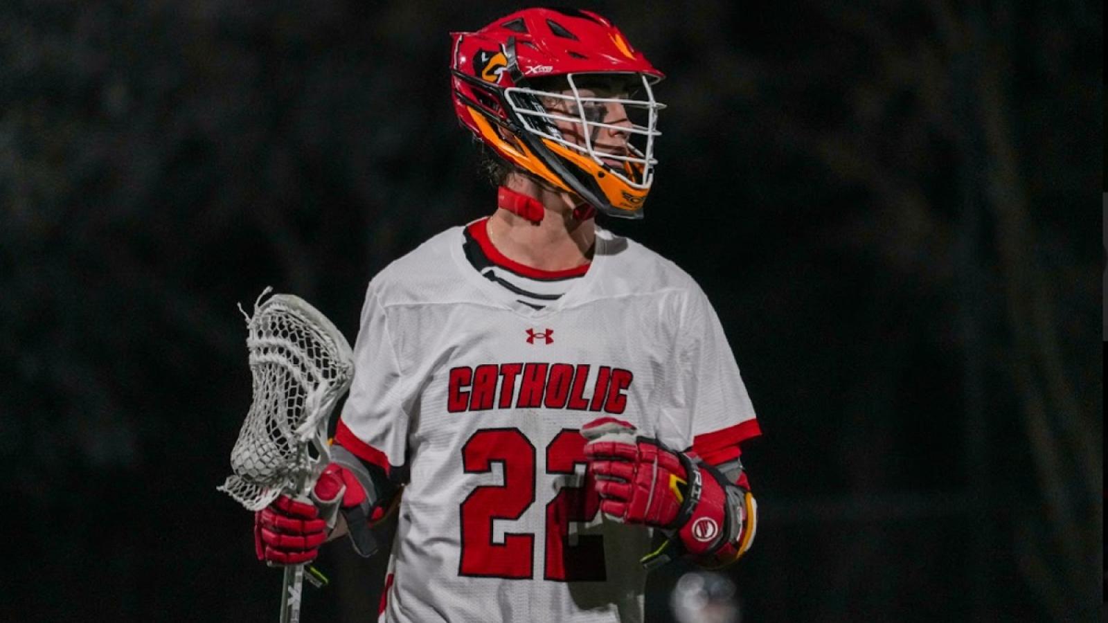 victor playing lacrosse on the CUA men's team
