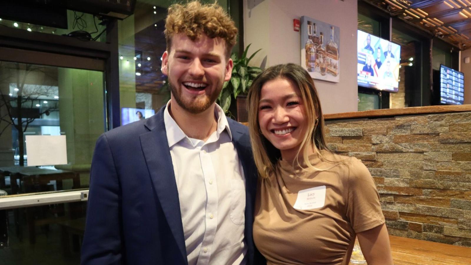 zachary and a friend at a business school social event