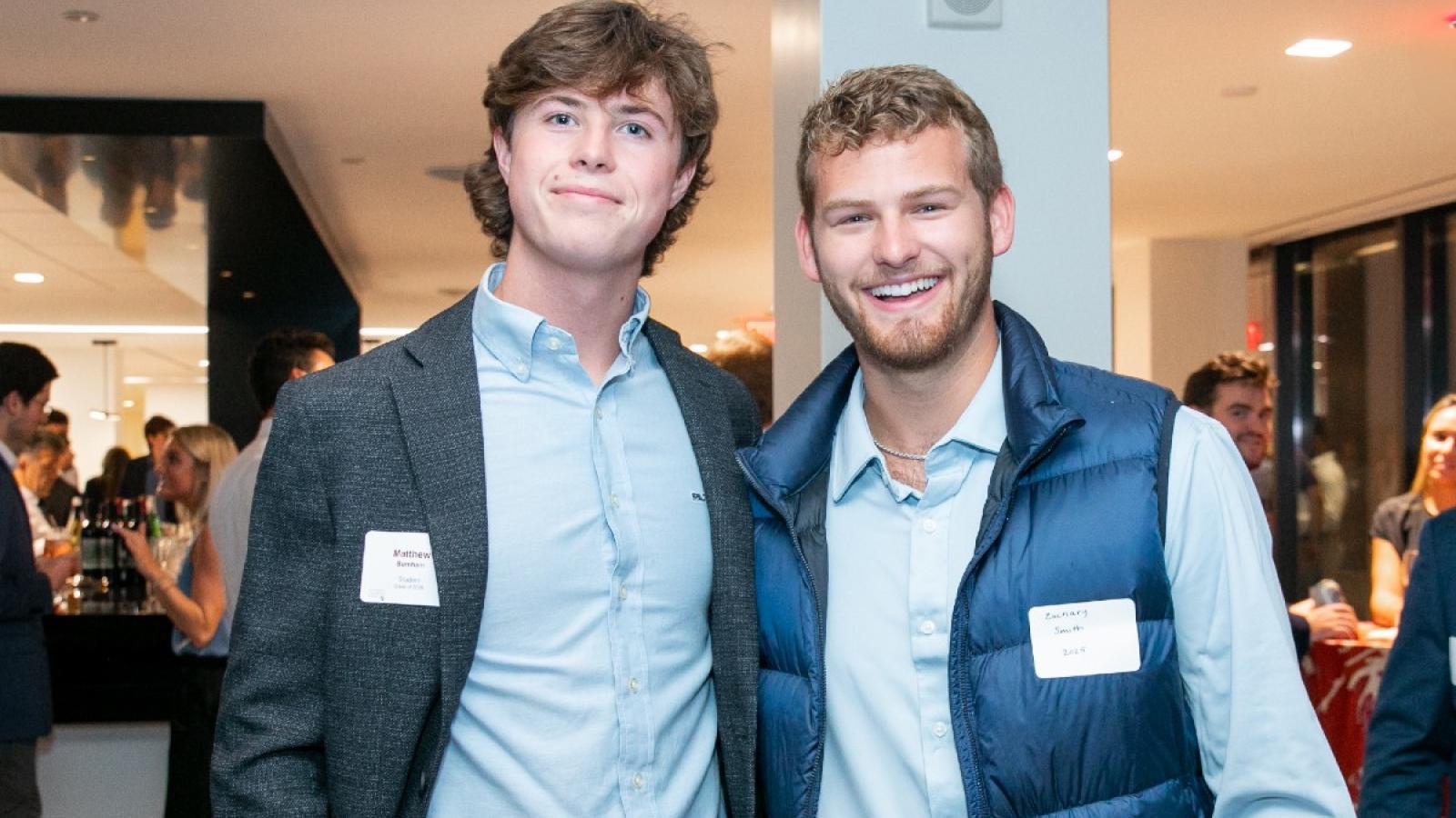zachary and a friend at a business school social event