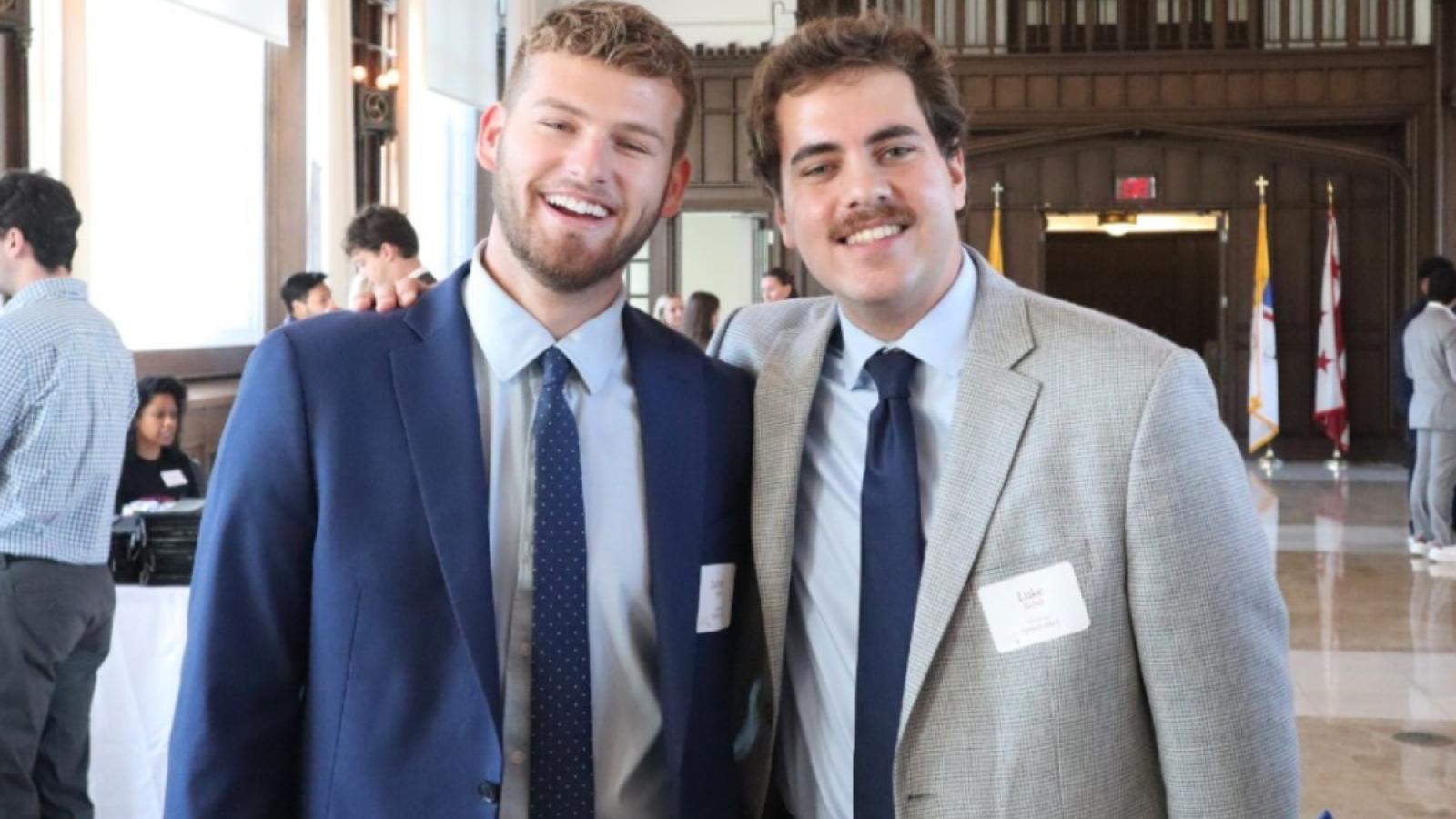 zachary and a friend at a business school event