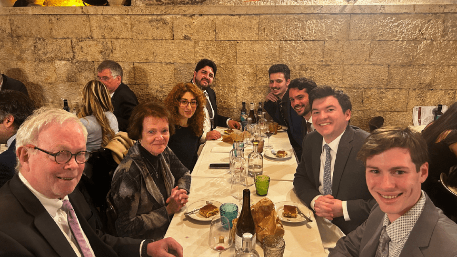 people networking at a dinner table