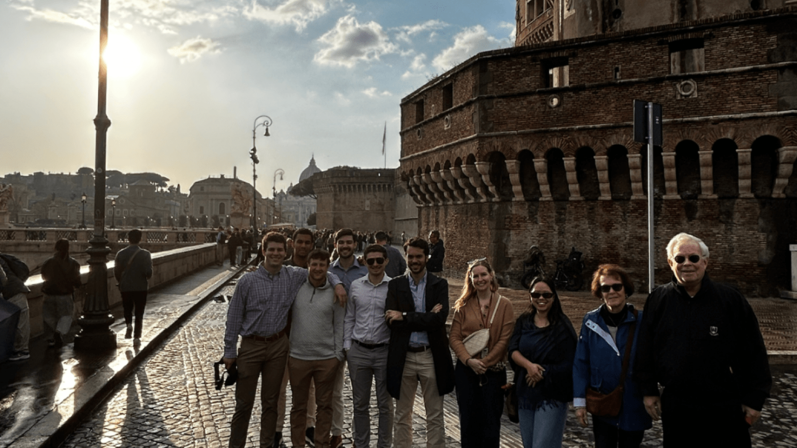 group of people taking a picture near water