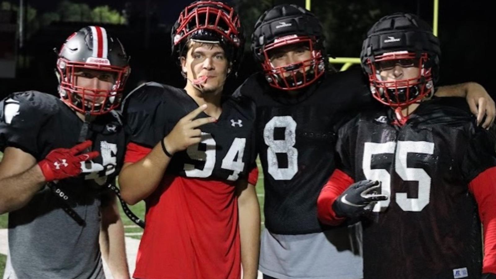 cameron and his football teammates in their uniform