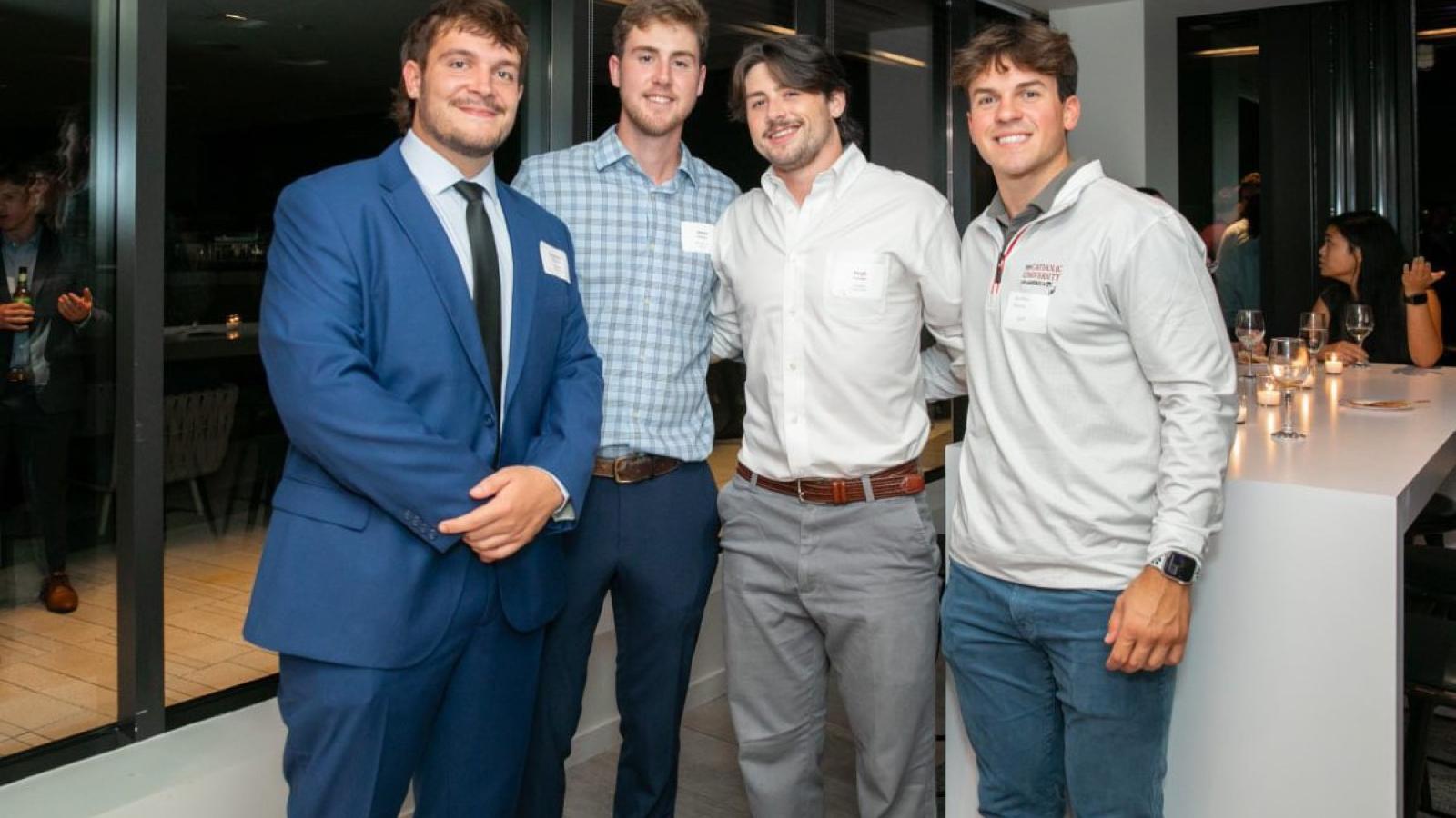 cameron and his friends in business casual attire