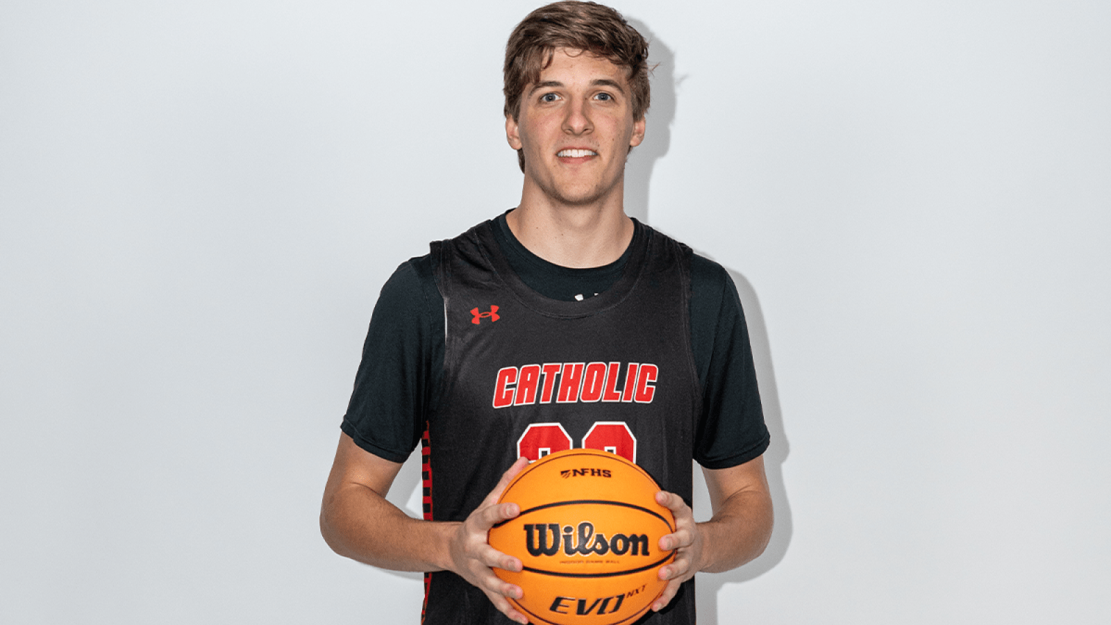 charley holding a basketball