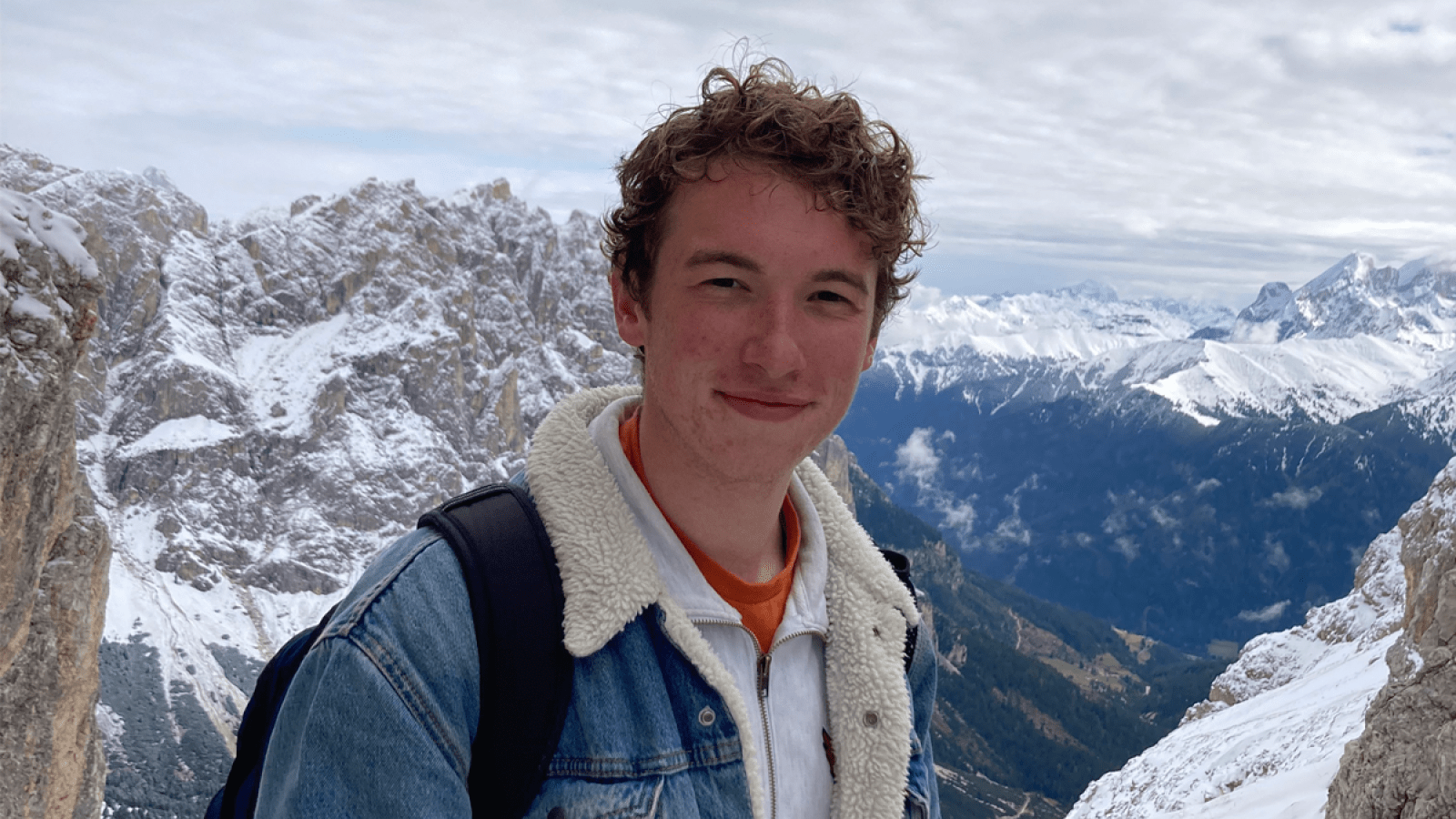Michael at the top of a snow covered mountain