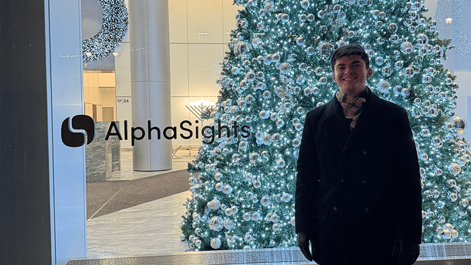 william in front of a christmas tree at Alpha Sight