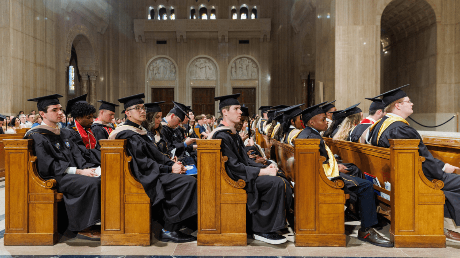 The students at the 2026 Commencement Ceremony, sitting in pews.