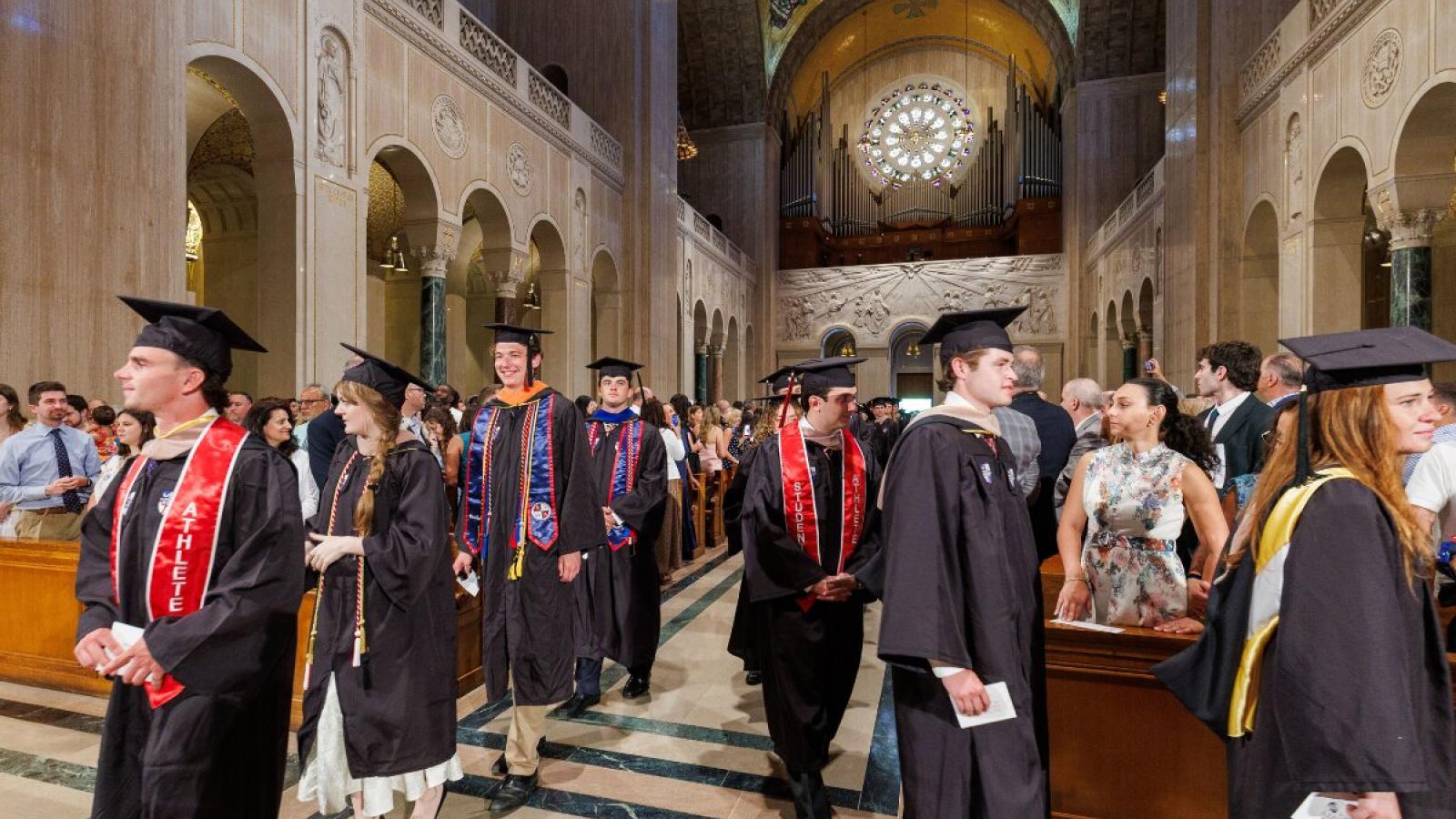 Students leaving the 2026 Commencement in the Basilica.