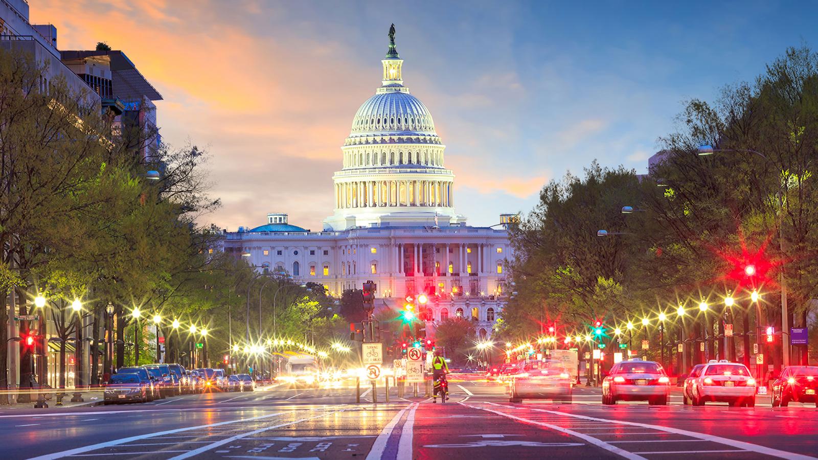 Capitol building and surrounding DC setting at dusk.