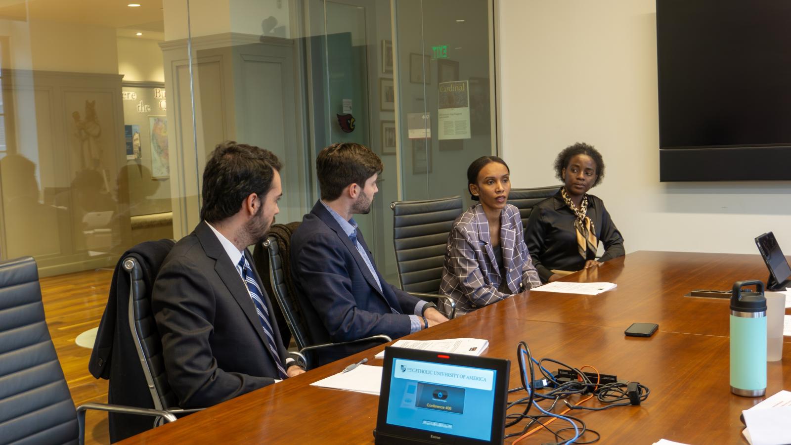 students sit in a conference room at the MBA Venture event