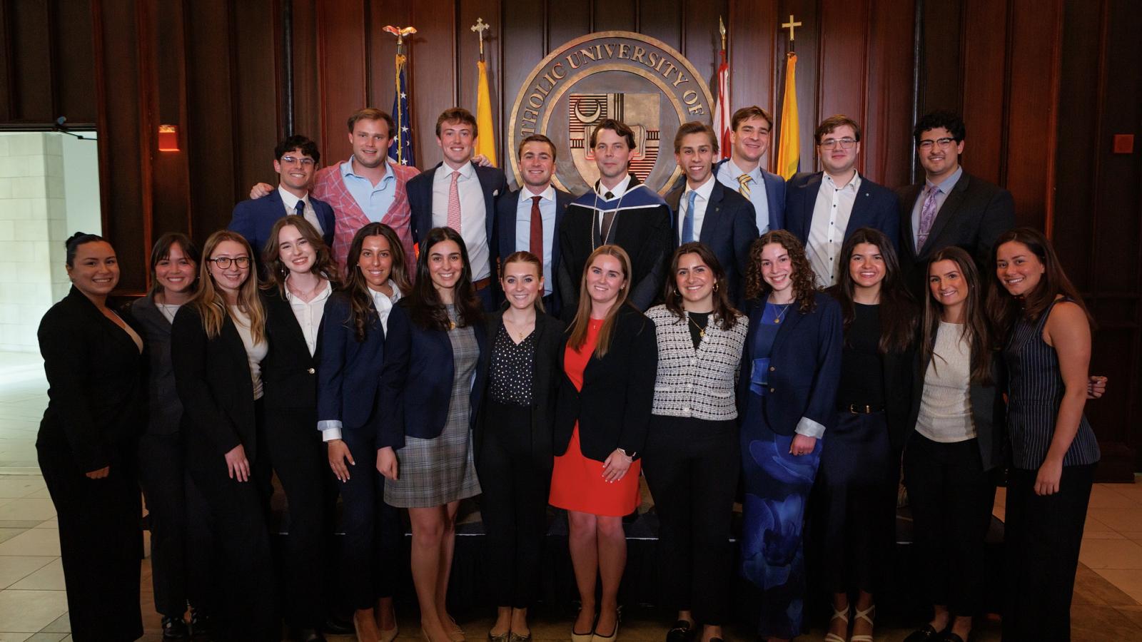 Professor Nicholas Schmitz with students at the chair inauguration event