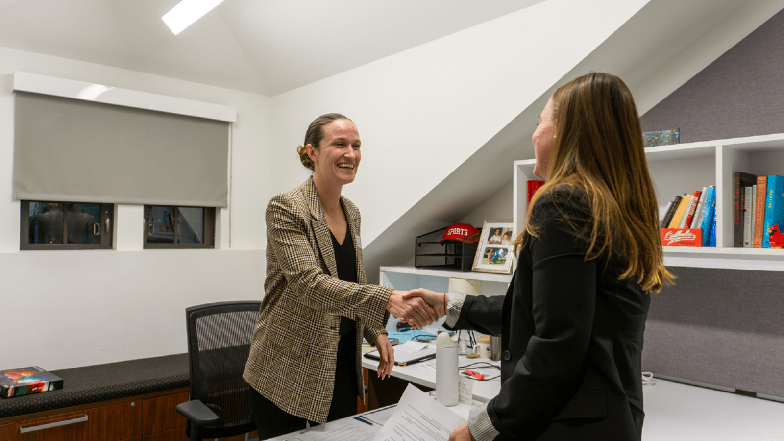 Photo of a student shaking a hand during an interview.