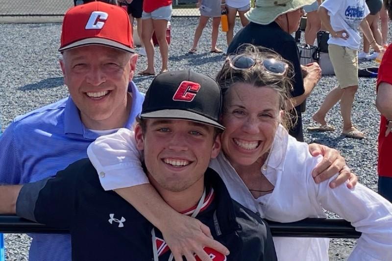 cormac and his parents at a CUA baseball game