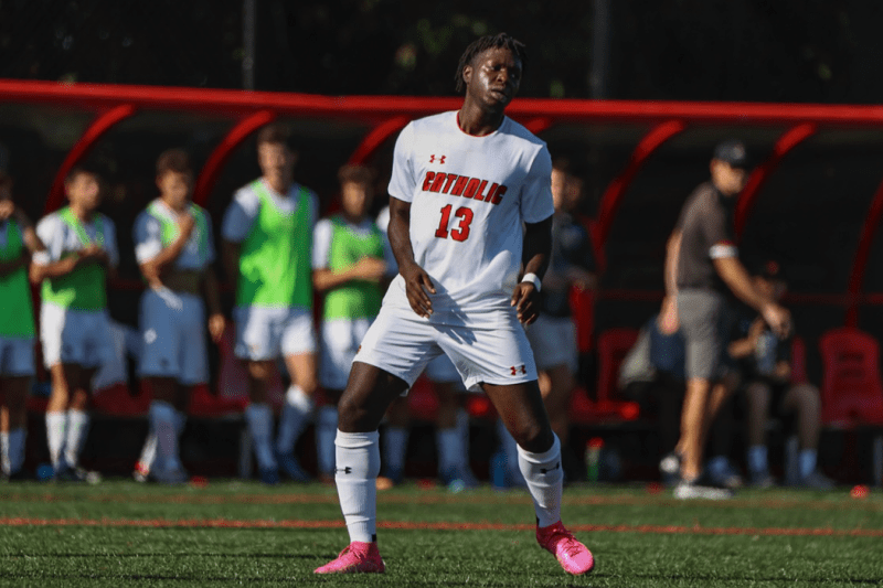 kwaku playing on the CUA soccer team